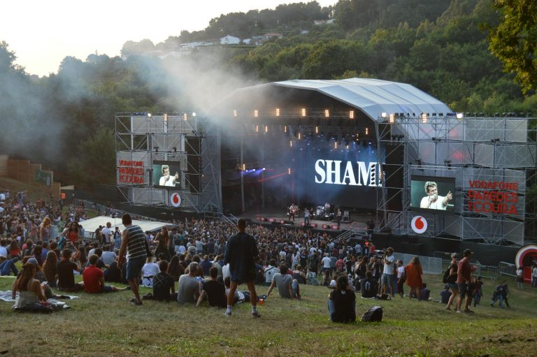 A lively outdoor concert at a music festival in Paredes de Coura, Portugal.